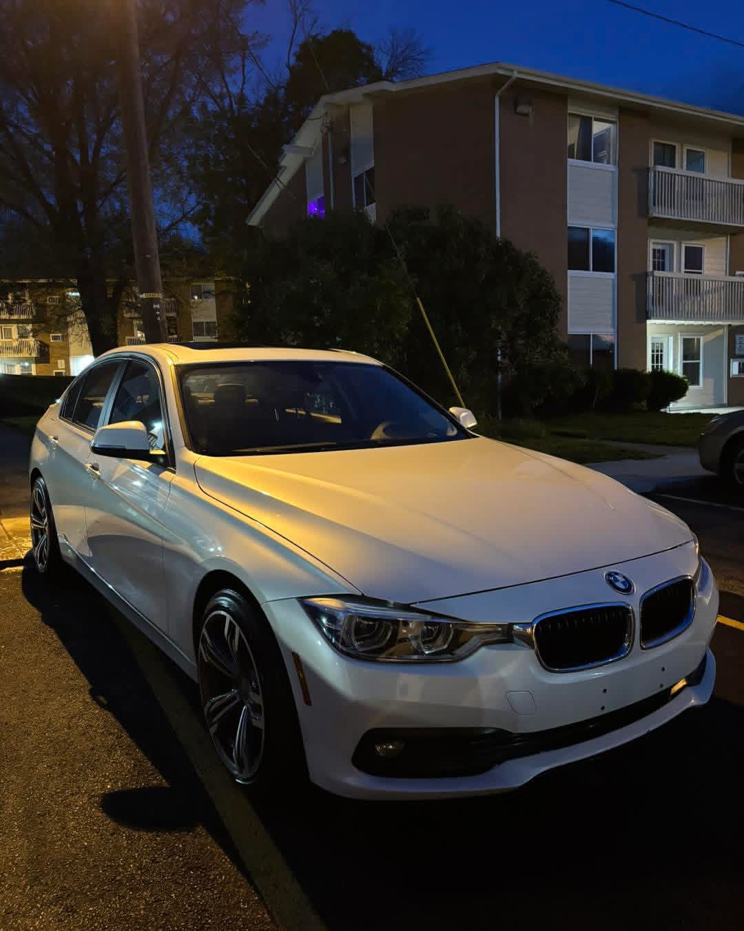 White BMW sedan with mirror-finish shine